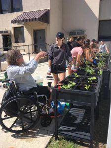 Students from St. Francis University work with seniors at Cambria Care Center in Ebensburg, thanks to a grant through CFA's Youth Philanthropy Interns program.